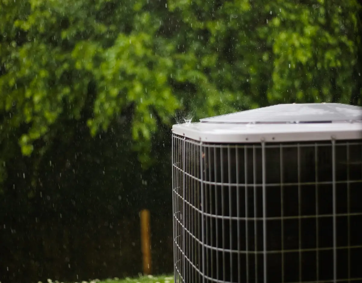 Residential outdoor AC condenser installed at a Dallas home