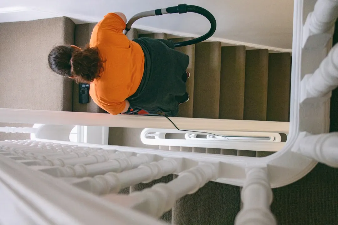 Duct cleaning technician with HEPA vacuum in Dallas