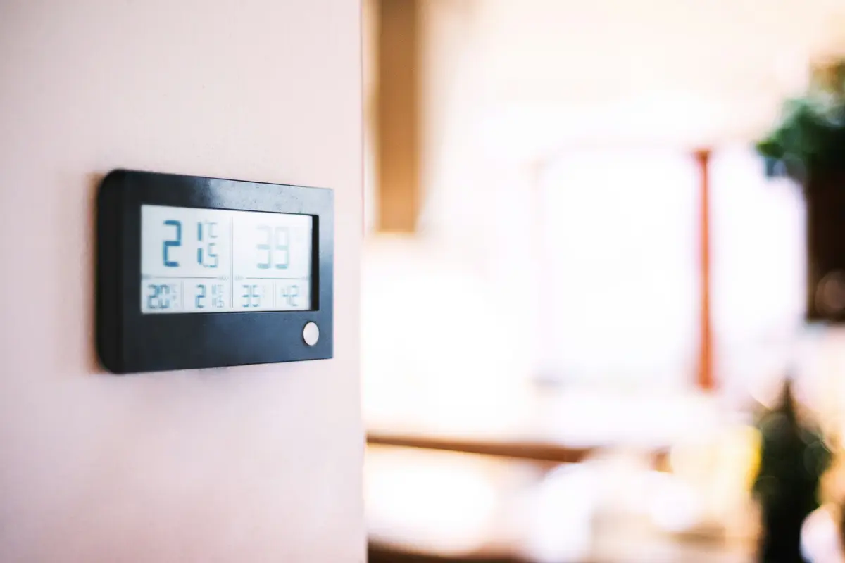 Modern smart thermostat on a residential wall in Dallas