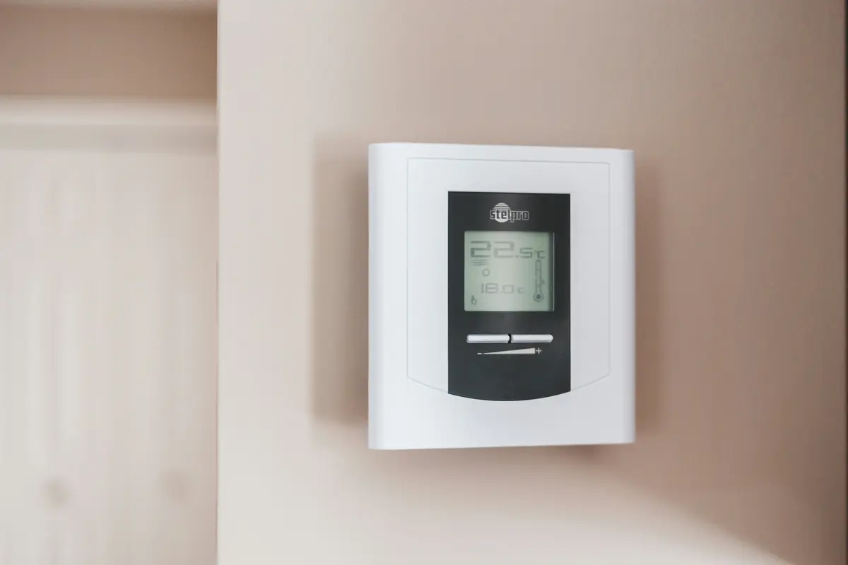 Smart thermostat installed on wall in a Dallas home
