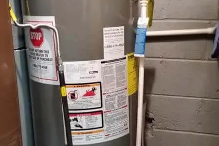 Water heater tank service in a Dallas basement